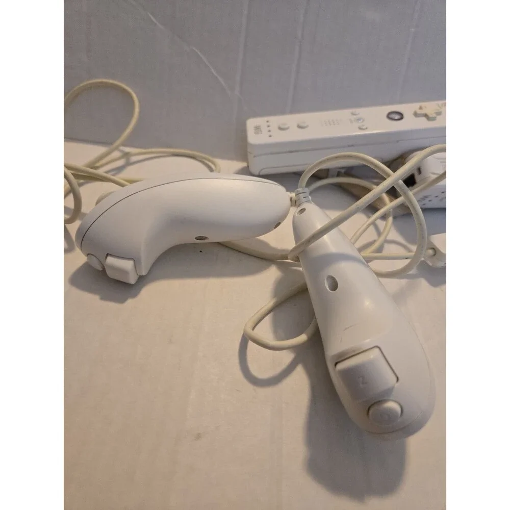 Pair Of Nintendo Wii Remotes With Nunchucks